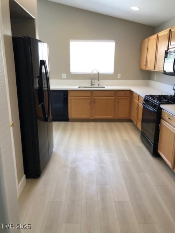 Kitchen featuring black appliances, stainless-stee