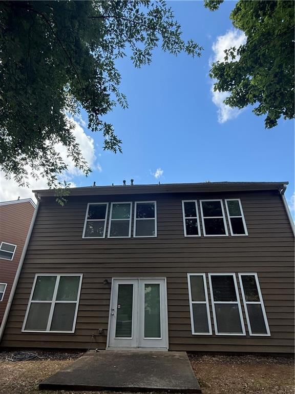 Rear view of property with a patio