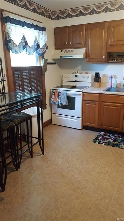 Apt #1, kitchen. Fridge & oven/stove stay