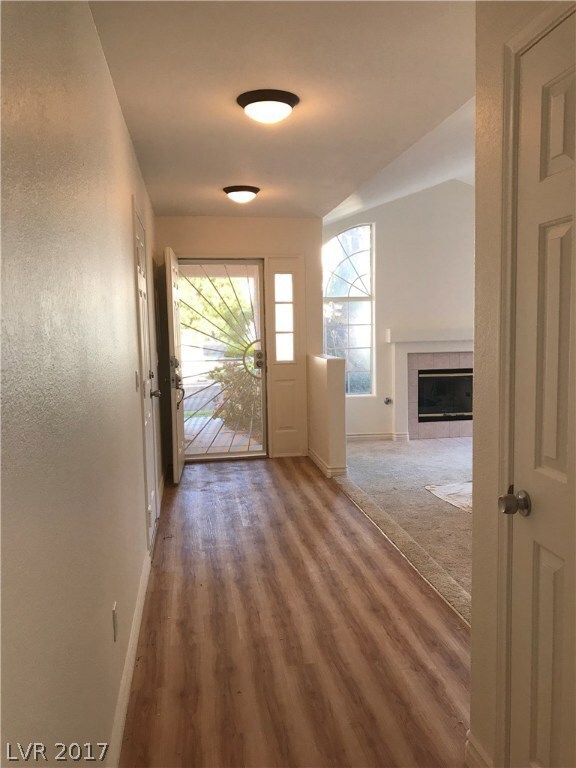  Entry to Foyer. Walkaway leading to kitchen and t