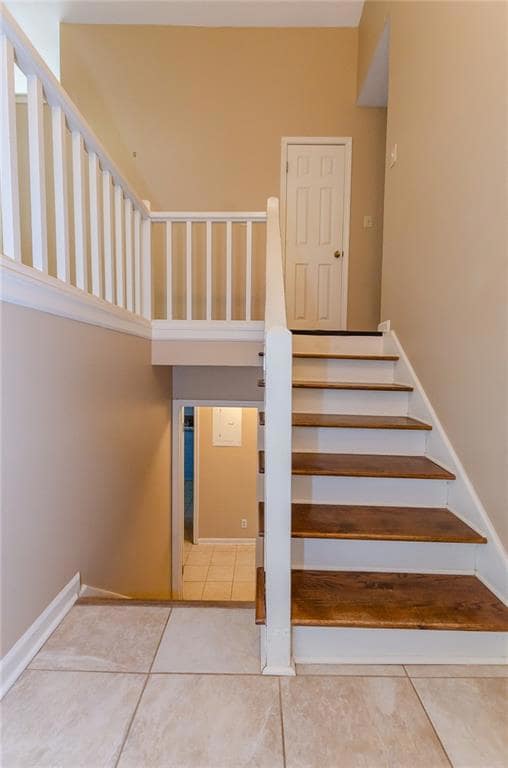 Stairs with tile patterned flooring