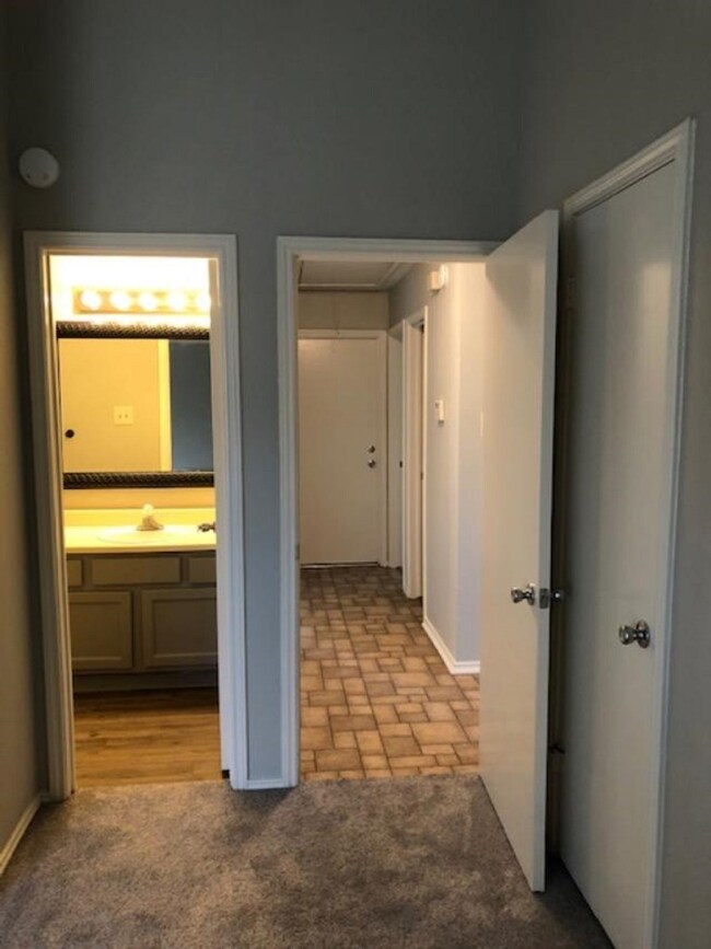 View from primary bedroom with full bath