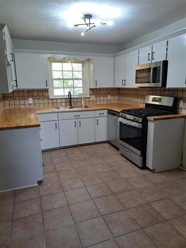 Freshly painted with new counters, appliances, and
