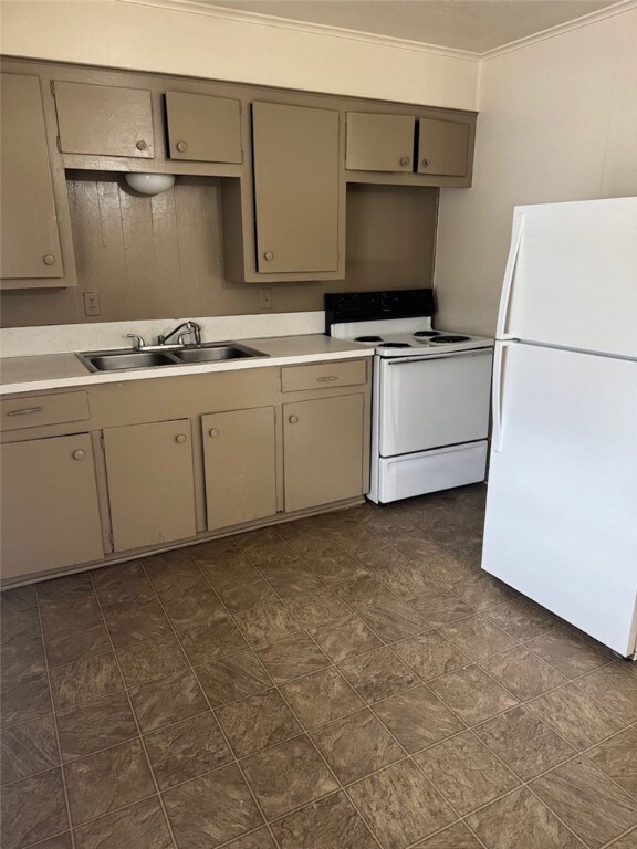 Kitchen with white appliances, a sink, gray cabine