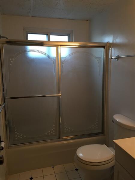 The updated bath offers a tub/shower conbination