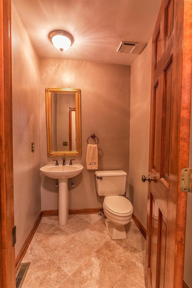 Half bathroom off of foyer. 