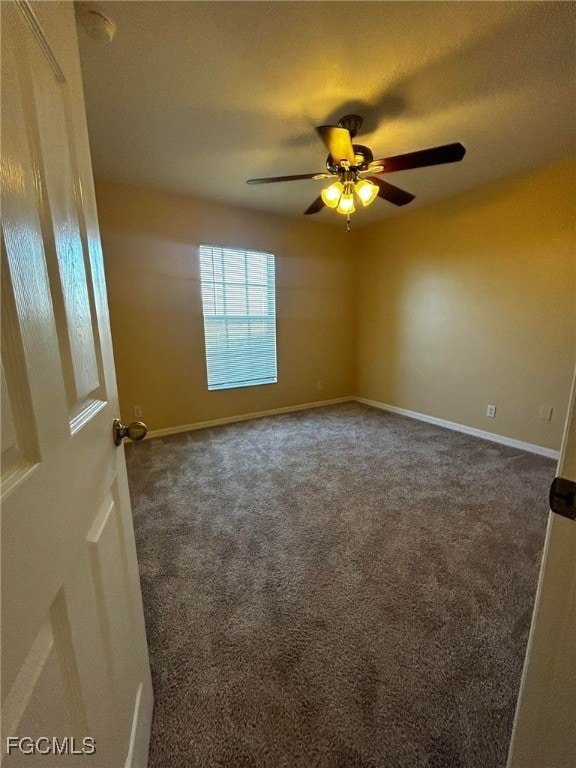 Spare room with carpet flooring and baseboards