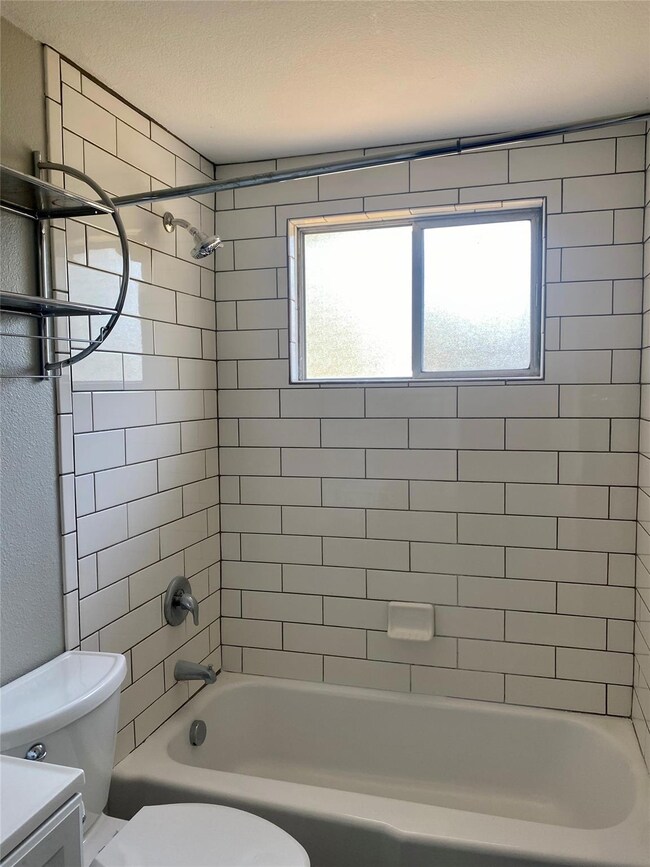 Full bathroom with shower / tub combination and vanity