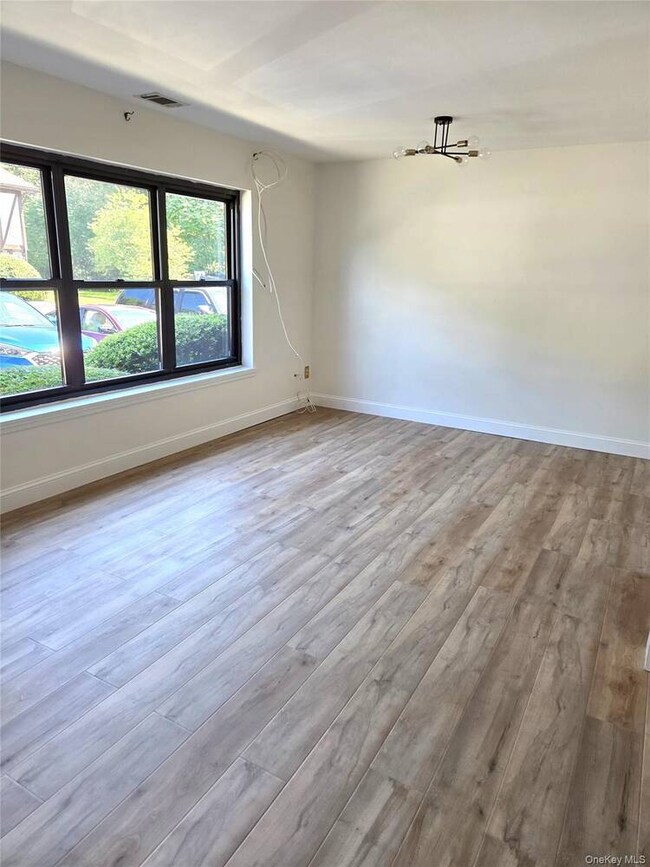 Spare room featuring light wood finished floors