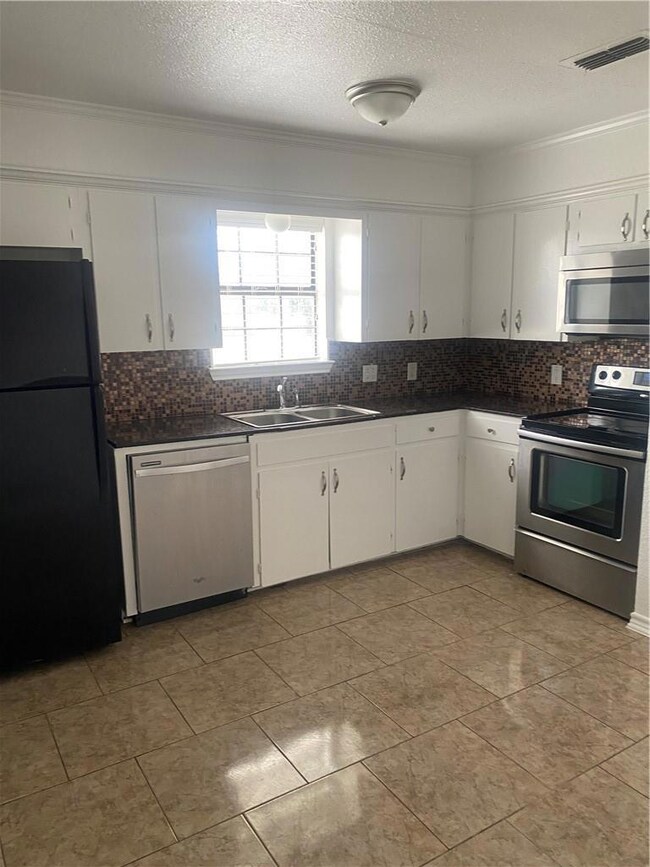 Remodeled kitchen with granite countertops, refige