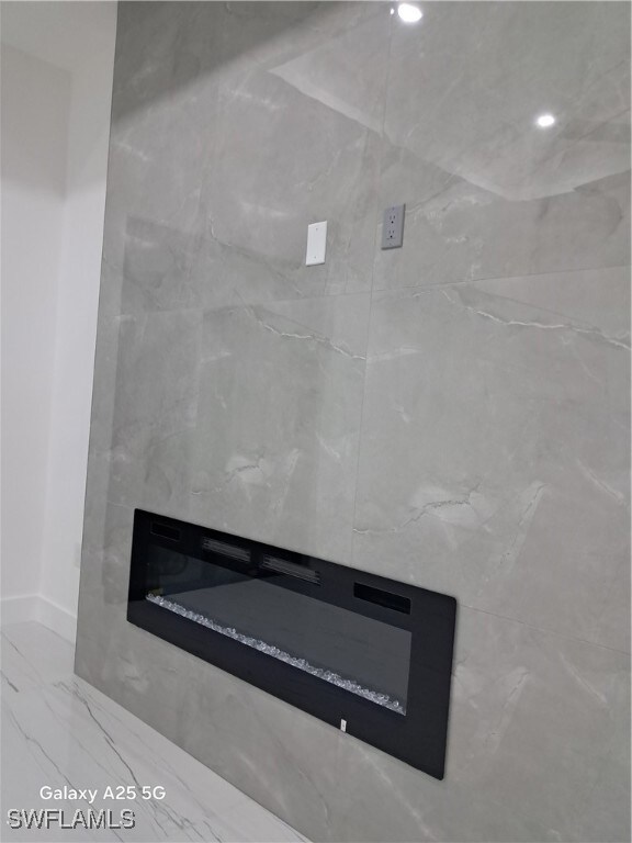 Detailed view of a glass covered fireplace and bas