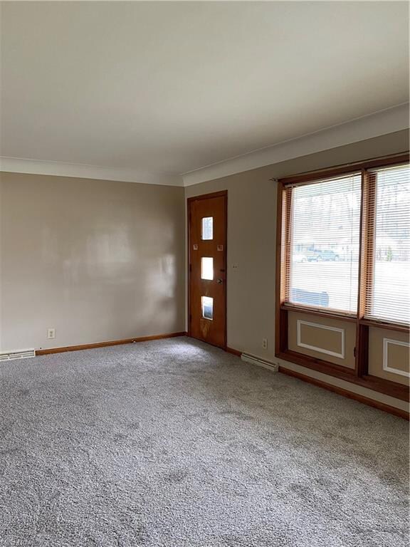 Living room 20 x 12 with new carpeting and paint.