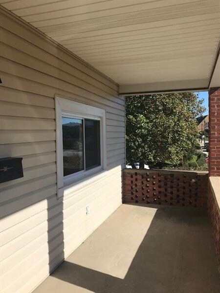 The front porch receives plenty of sunlight