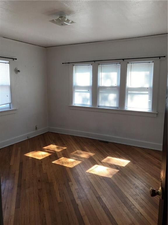 Bedroom with hardwood flooring!