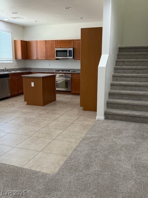 Kitchen featuring wall oven, dishwasher, cooktop,