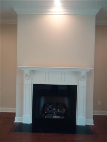 A beautiful custom gas fireplace is the focal point of the living room.