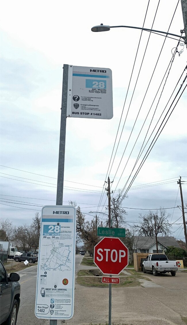 This photo shows the stop sign and street light. T