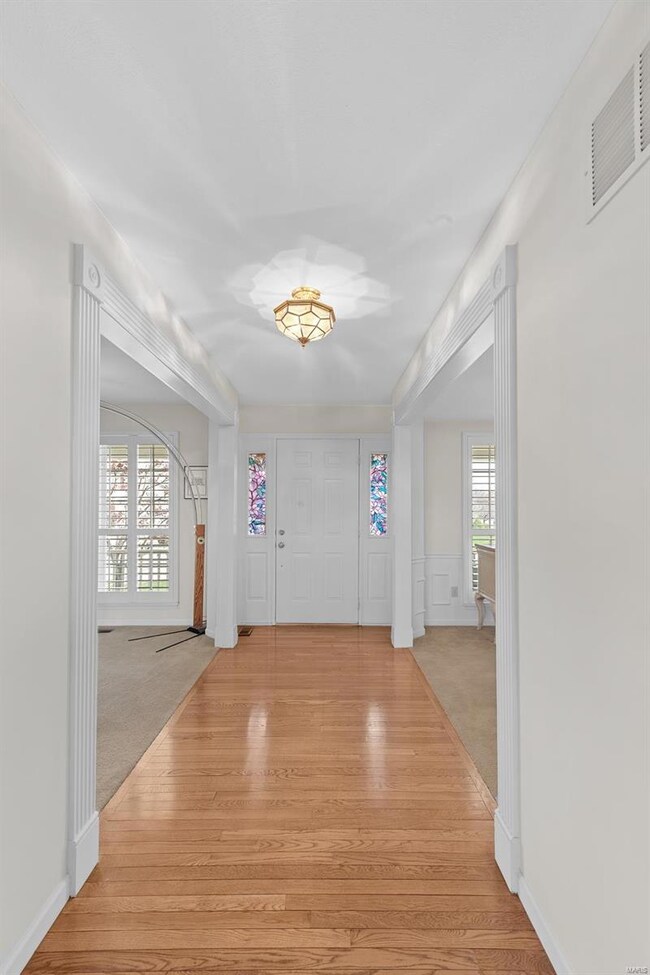 GLEAMING Hardwood Floors in the Entry Foyer with W