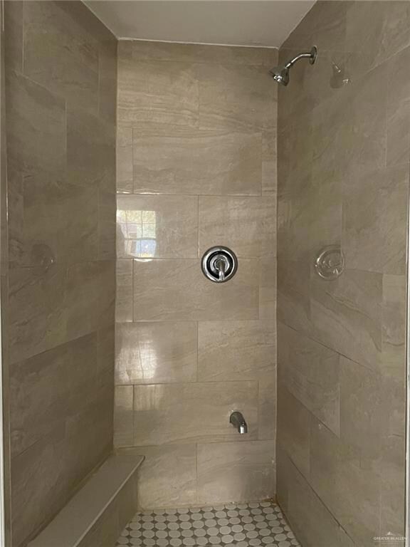 Full bath with a shower stall