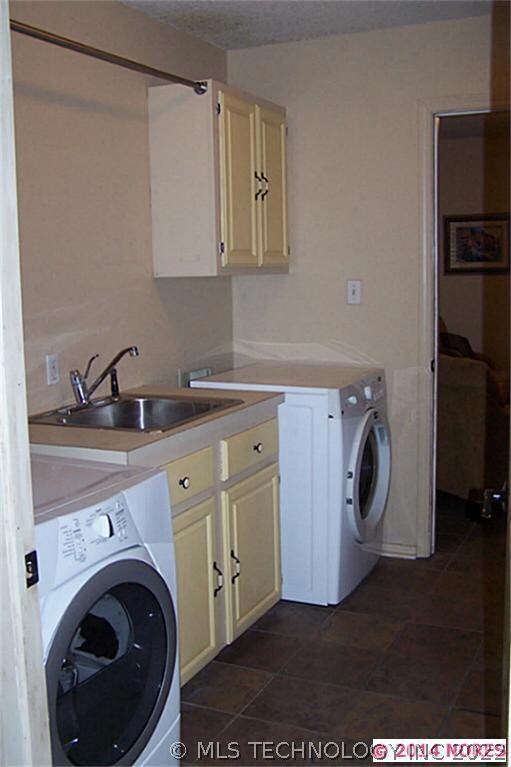 Large laundry room with sink and big storage close