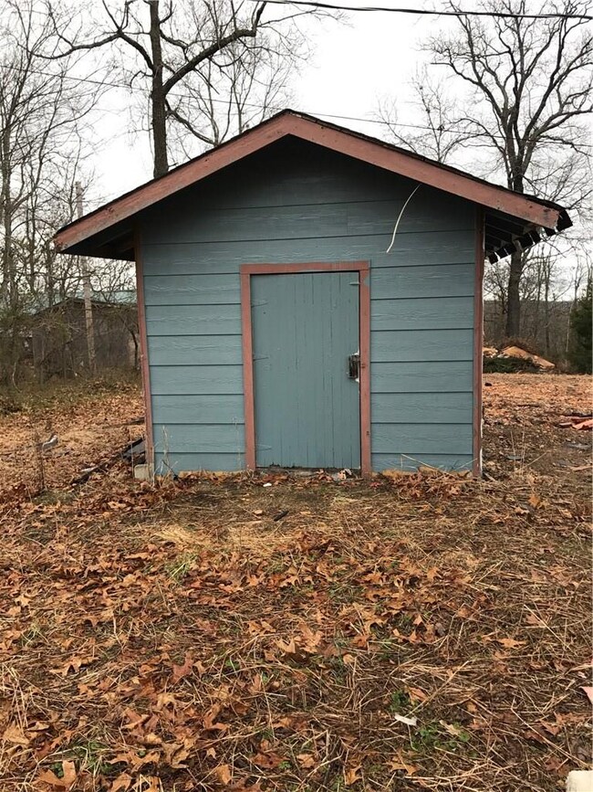 Storage building in back of the house