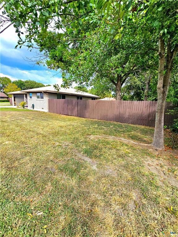View of yard with fence