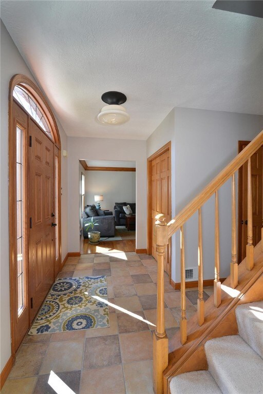 Main Entry highlights the beautiful newer oak doors throughout house