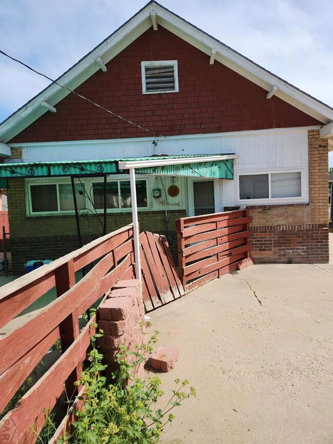 Back of home with covered patio