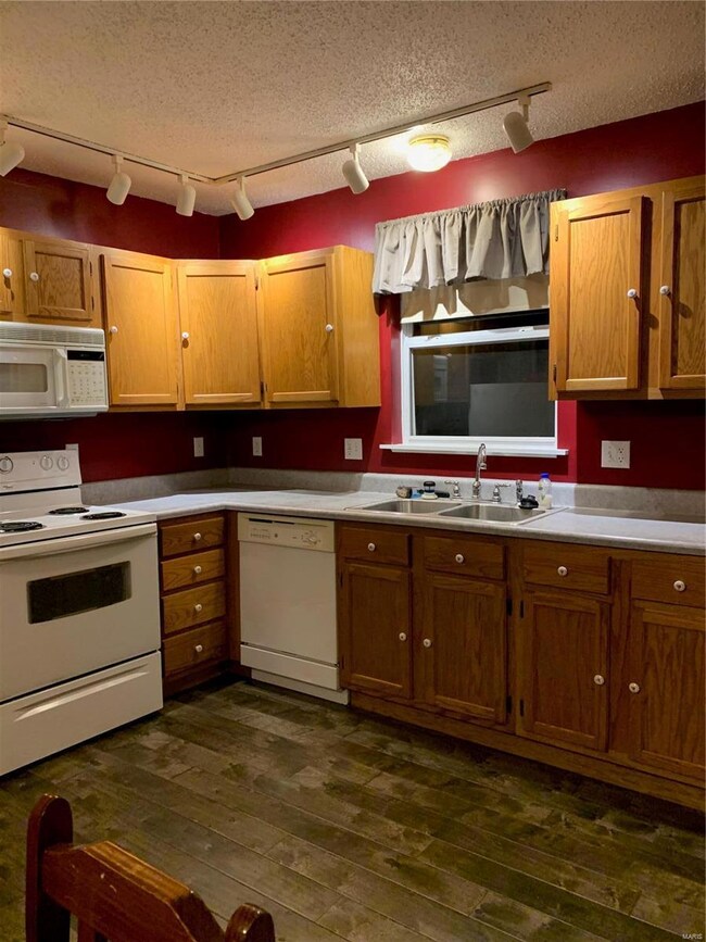 Beautiful kitchen which includes panty, stove, gar