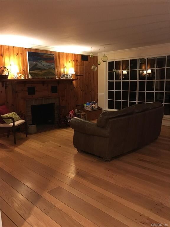Living area with large windows over looking the pa