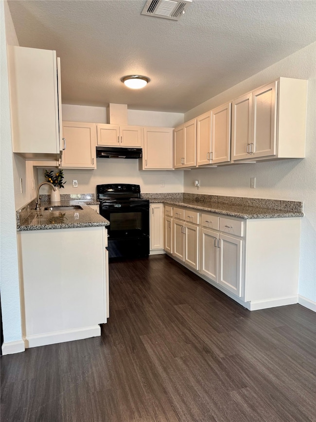 Kitchen has many cabinets for storage.
