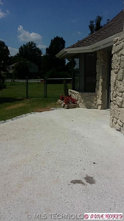 good sized patio out back and fenced dog area