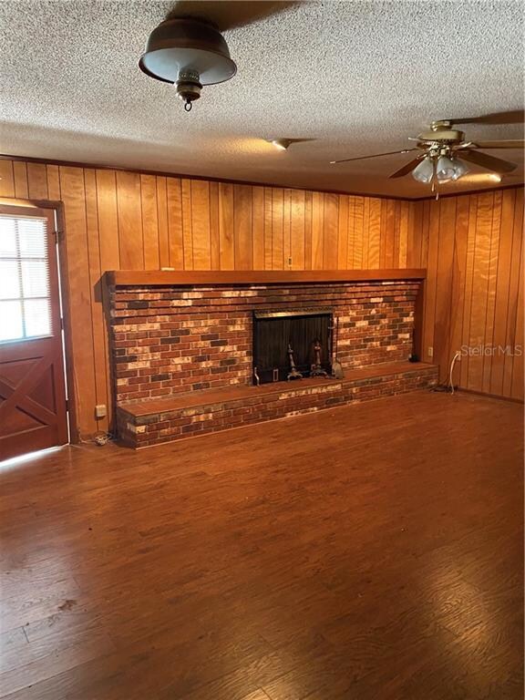 Family room with brick fireplace.