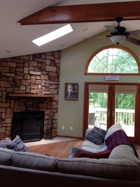 View from the kitchen. Beautiful stone fireplace, 