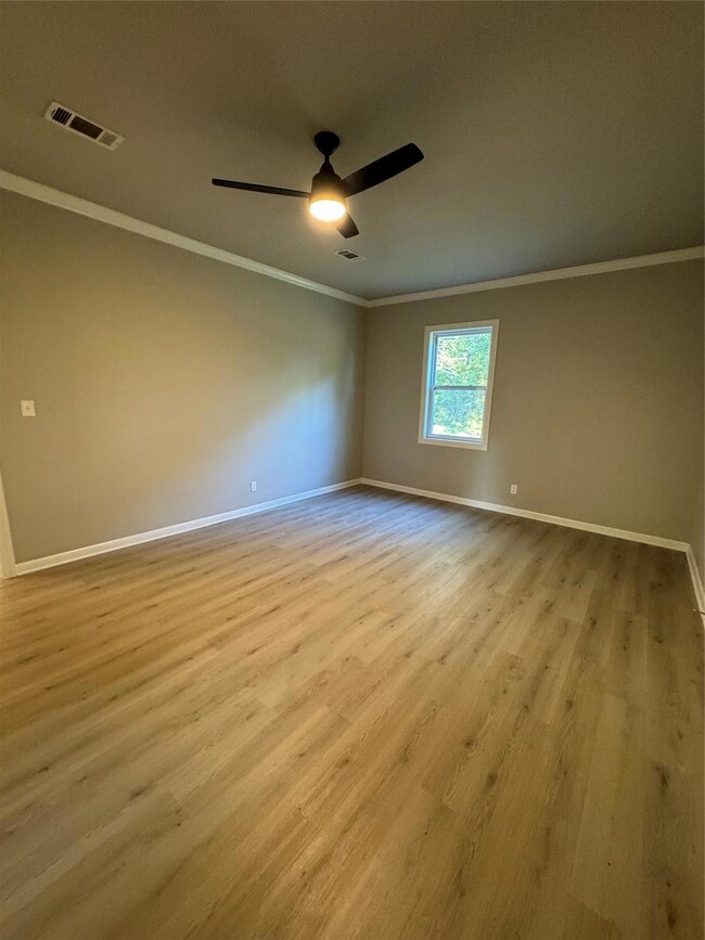 Spare room with light hardwood / wood-style floors