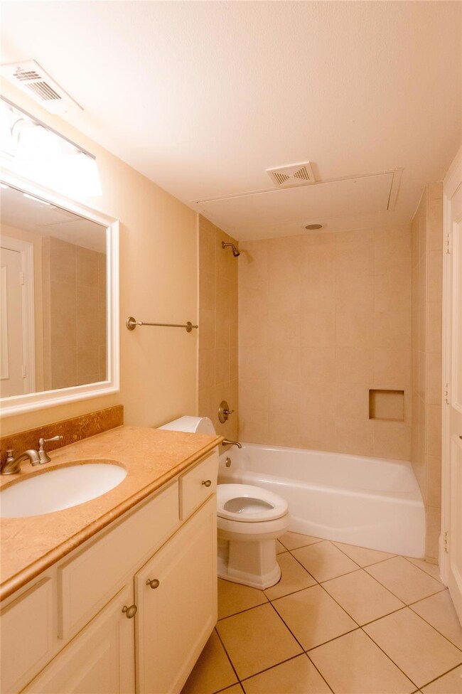 Full bathroom featuring tile floors, large vanity,
