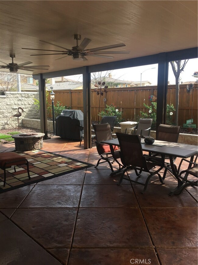 Insulated patio cover with ceiling fans and speakers for outdoor entertaining, drought resistant landscaping already in place!