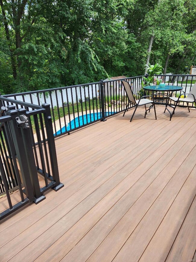 Newer composite deck with Iron rail and gate to st