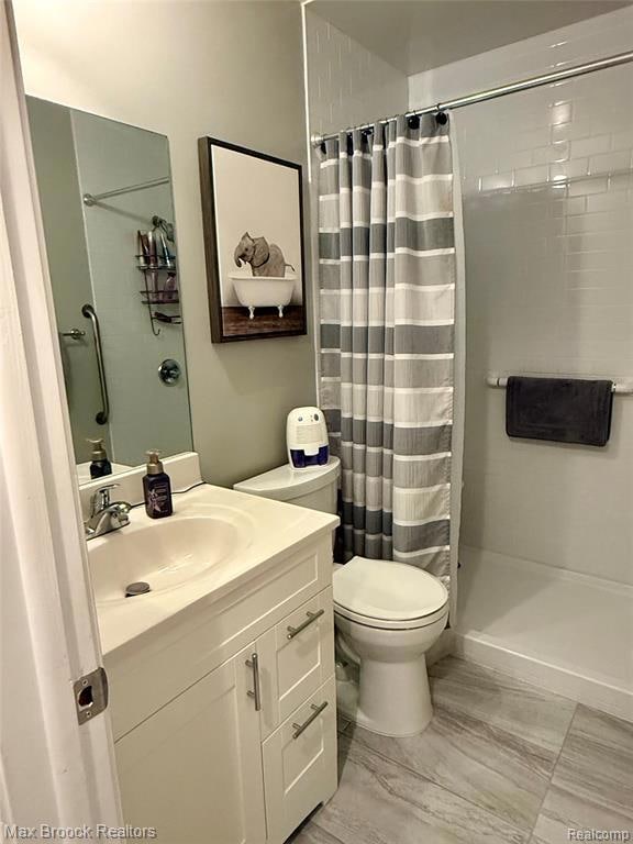 Full bath featuring vanity and a stall shower