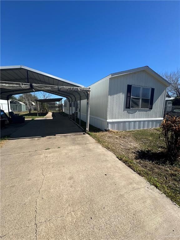 View of home's exterior featuring a carport