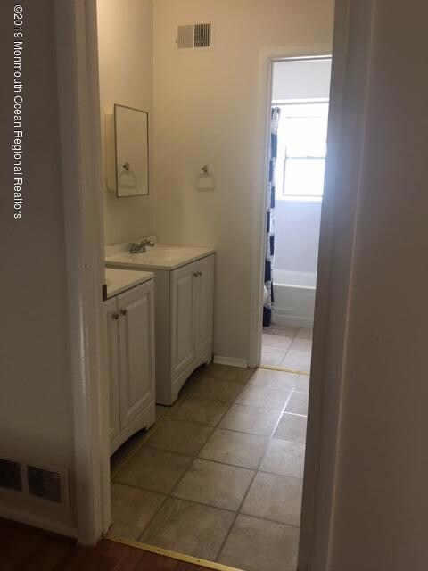 main bathroom with double vanities