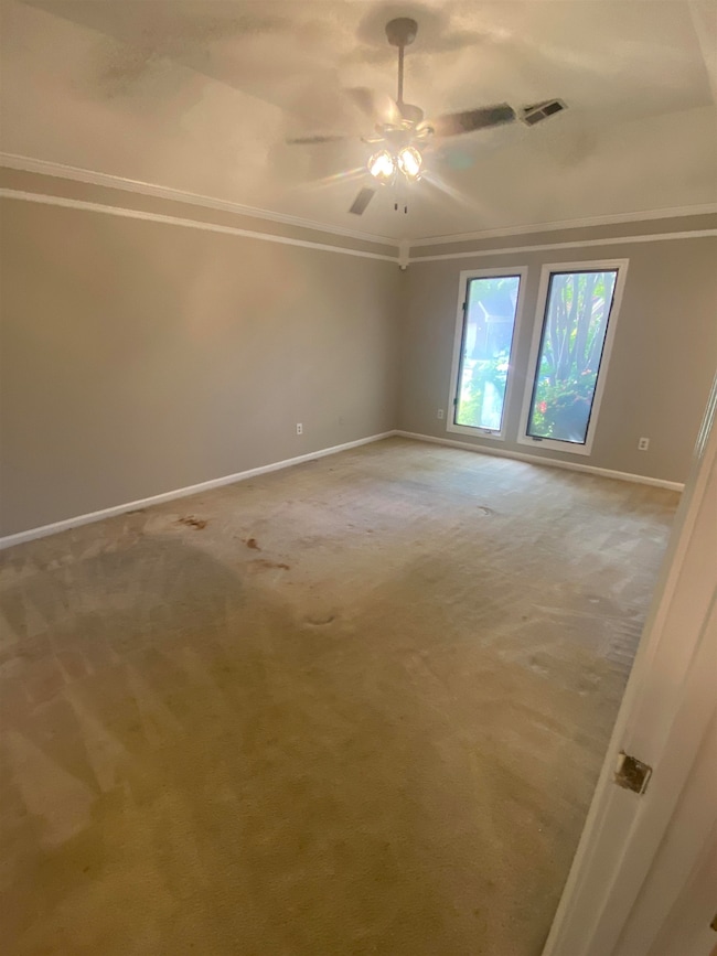 Master Bedroom with on suite bathroom and carpet f