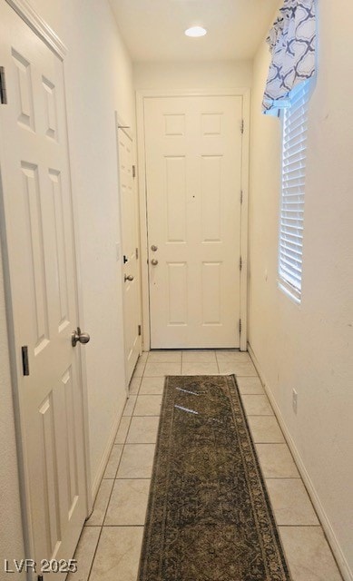Doorway to outside with light tile patterned floor