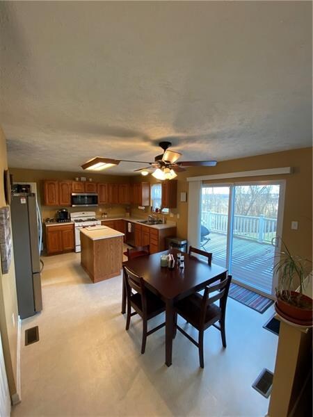 A wonderful back yard and large deck awaits just off the eat in kitchen