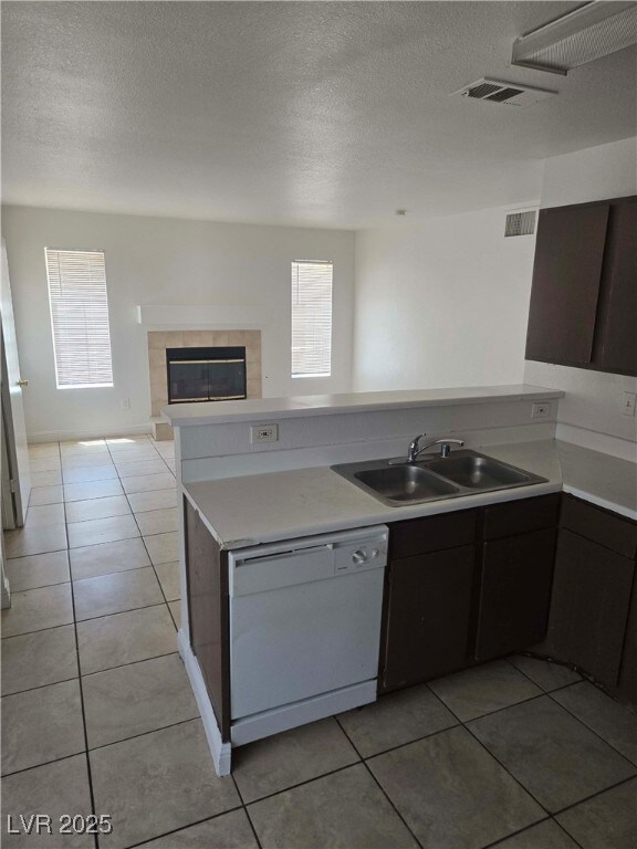 Kitchen featuring dishwasher, light tile patterned