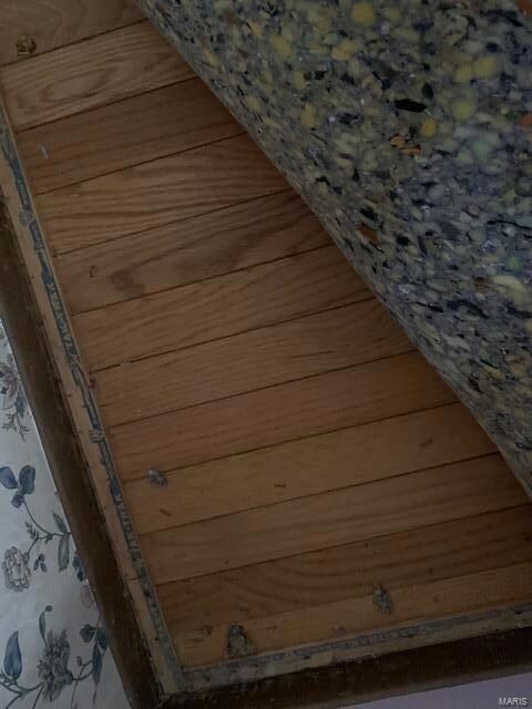 wood floor under carpet in livingroom.  Just to ri