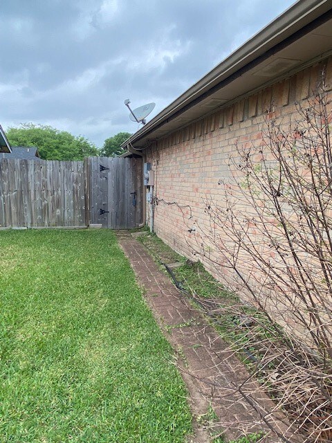 Gate and stone path to backyard