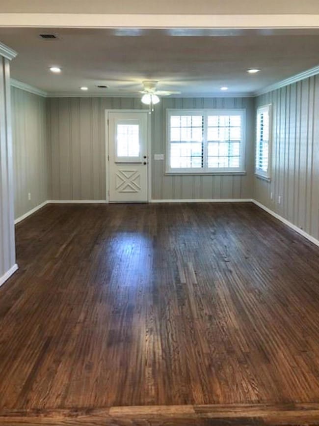 Living Room room featuring hardwood / wood flooring, ceiling fan