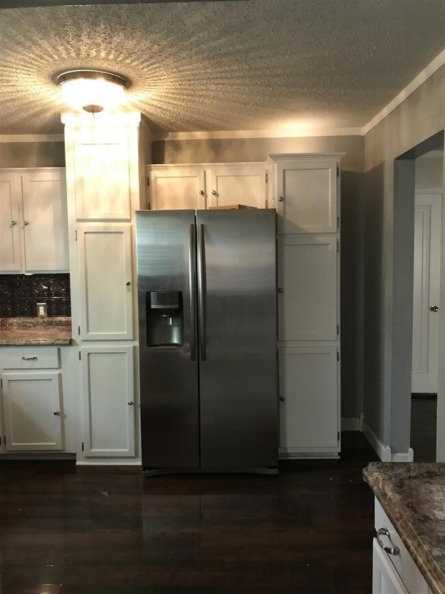 Another view of the L-shaped kitchen.