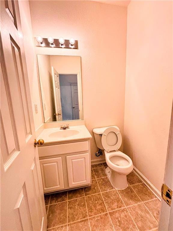 Bathroom with vanity, tile patterned flooring, bas